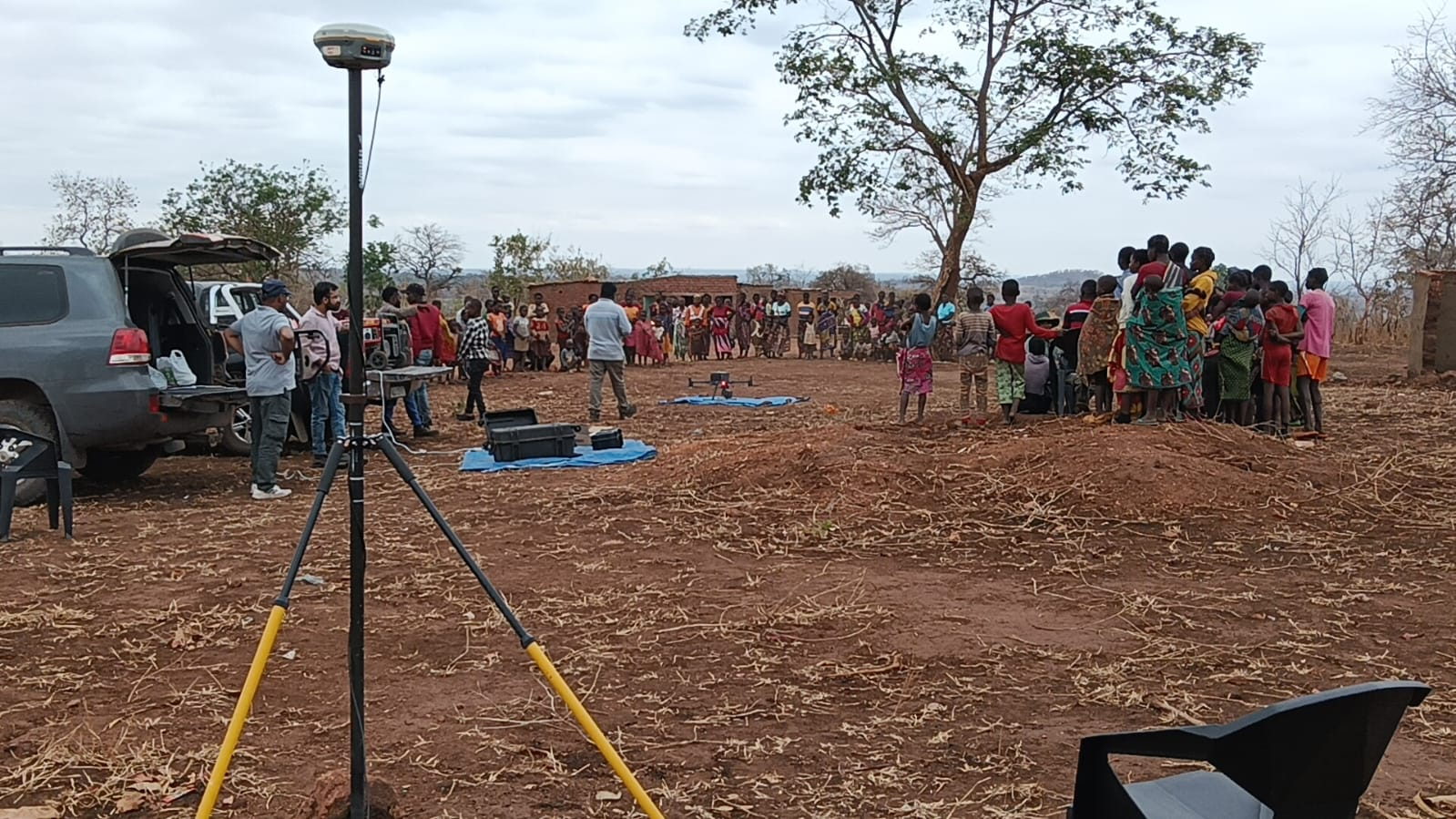 Survey equipment and crew set up at a remote site before a drone inspection