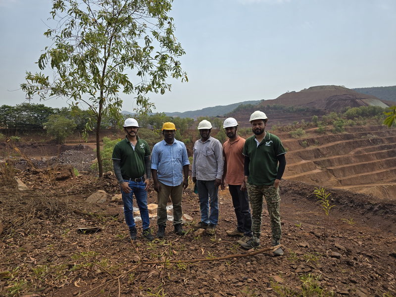 Project team standing at an active iron-ore mine bench survey site