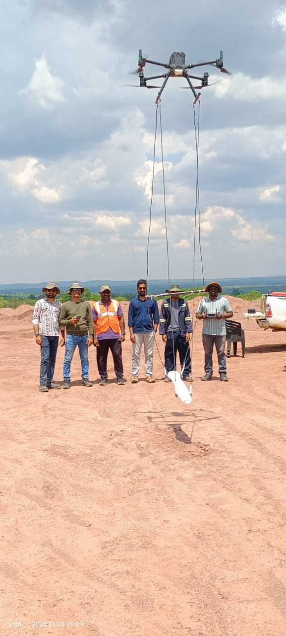 Survey drone hovering with a magnetometer loop during a calibration pass